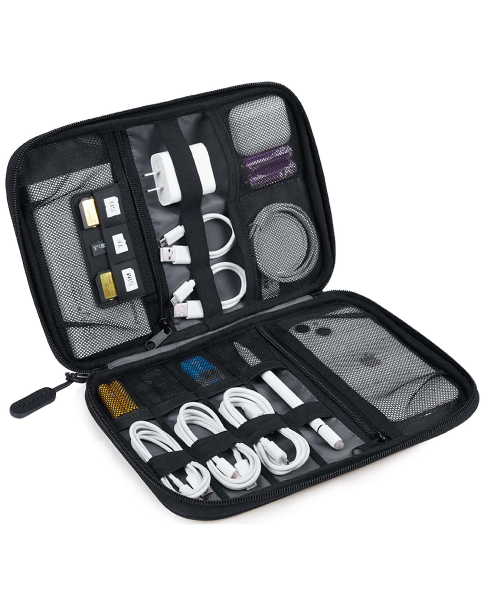 Traveler packing power bank and headphones in organizer bag