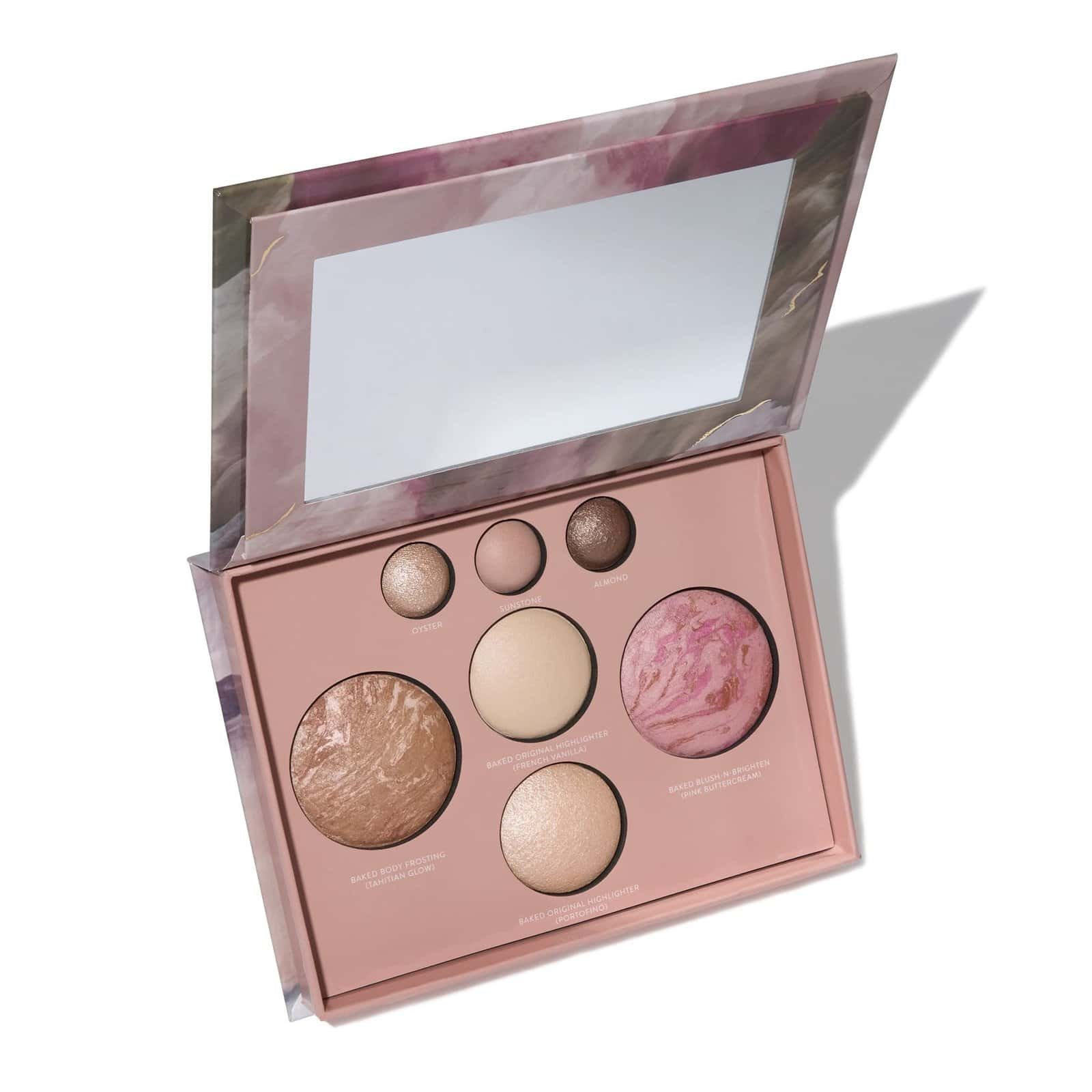 Makeup artist applying baked foundation with brush
